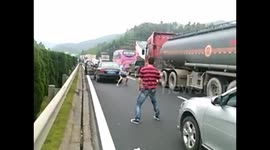 Gridlocked travellers play badminton on motorway to kill time
