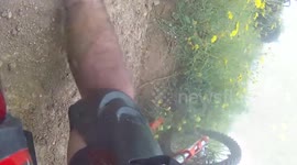 Dirt bike rider has head-on smash with quad bike