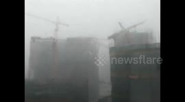 Tornado storm blows down crane in southern China