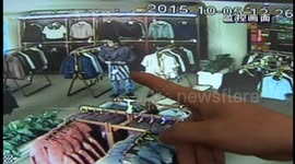 'Shoplifter' caught on camera stuffing jackets down his trousers