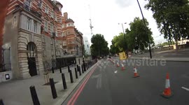 Van ignores signs and almost crashes into bike (no watermark)