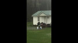Man gets creative to walk through flooded garden