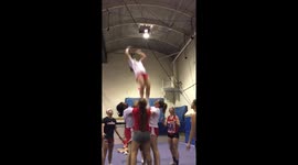 Cheerleader fail - Girl thrown in the air nearly takes out whole team