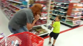 Dad with Halloween mask scares toddler son in shop