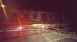Burnt-out hulk of a train pulled along tracks in Cape Town after 'arson'
