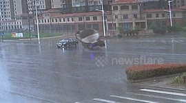 Car driver survives crash with tanker at wet crossroads