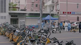 Barrier of bikes blocks road as Shanghai eases lockdown restrictions