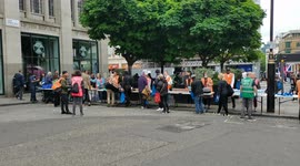 Homeless people queue for food at Strand, London, UK