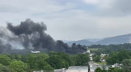 Plane lands through plumes of smoke from major fire near Geneva Airport
