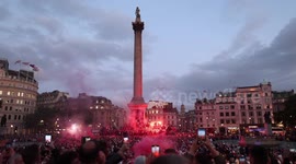 Sunderland Athletic Football Club Fans hold flares as they gather in Trafalgar Square in Central London