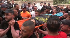 Palestianians carry body of 17-year-old man shot dead by Israeli authorities