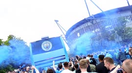 Manchester City fans excitedly await team buses ahead of Premier League Decider