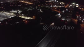 Car rearends into a car with taillights off after avoiding another car that crashed into pole on highway