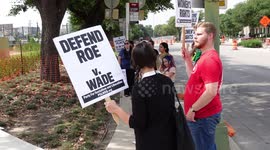 Abortion rights activists receiving marching instructions at rally instructions front of US Federal Courthouse in San Antonio, Texas