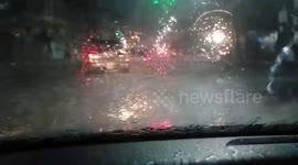 Cars stall on road flooded by monsoon rains in Myanmar