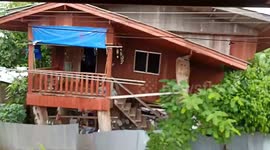 Flash flood destroys house as northwestern monsoon dumps heavy rain in Thailand