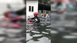 Worker evacuated as tidal floods inundate Indonesia