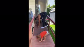 Enthusiastic 2-year-old teaches grandad tough dance routine