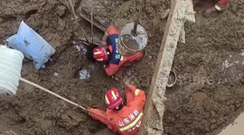 Chinese firefighters rescue worker buried in mud in mixing tank