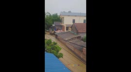 Residents of northern Vietnam climb on roofs to avoid flash floods