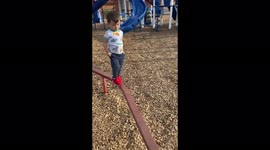 ''OUCH!' 3 y/o boy loses his footing while walking on a balance beam'