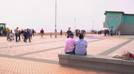 Adorable moment man proposes to his girlfriend of almost ten years with surprise flash mob