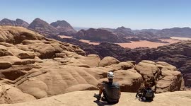 Climbers enjoy stunning view from the top of Jordan's Al Khazali mountain in the Wadi Rum desert