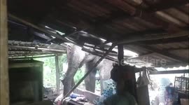 Hungry wild elephant destroys monk's house and steals food in Thailand
