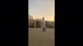 'Boy uses his exceptional football skills to pull off a... basketball trick shot! '