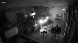 Car smashes into BBQ shop after motorist falls asleep at the wheel in China