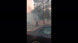 Fire erupts as Pakistan police violently clash with former prime minister Imran Khan supporters