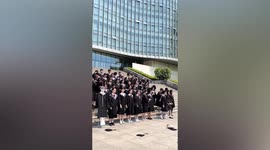 Students take graduation photos with classmate's cardboard cut-out in China