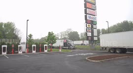 Empty Tesla charging stands on traveler service plaza  before Exit 13 on I-95