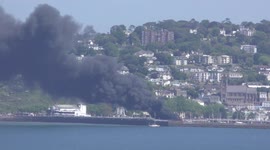 A $7.5m super-yacht goes up in flames in Torbay in Devon, south-west England