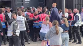 Huddersfield fan tries to break through a cordon