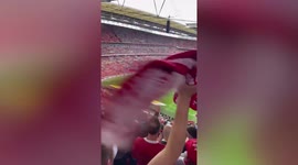 Nottingham Forest fans wave red scarves in Wembley Stadium following play-off victory