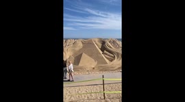 Tourists view impressive sand sculptures at festival in South Korea
