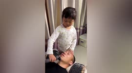 Hilarious moment daughter shaves unsuspecting father's eyebrow off