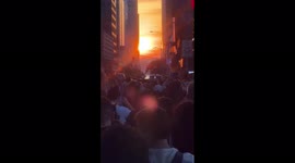 Hundreds of tourists line New York street to capture Manhattanhenge