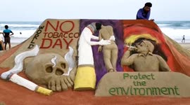 International Sand Artist built a sand sculpture at Puri beach on the occasion of “World No Tobacco Day