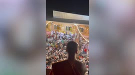 Huge crowd gathers as popular Buddhist monk performs ritual in Thailand
