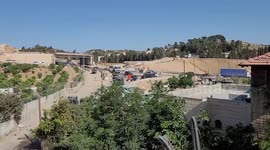 Israeli security forces take postion at the entrance of Al-Arroub refugee camp in the West Bank city of Hebron