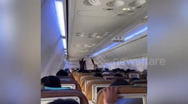 Passengers scream as turbulence rocks plane during aborted landing in Indonesia