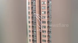 Kids in China fly toilet paper as kite from high-rise balcony