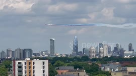 The Red Arrows aerobatic team perform a fly past over London's skyline towards Buckingham Palace for the Queen's Platinum Jubilee