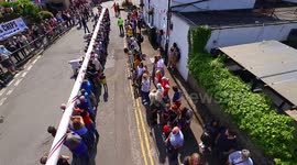 Community turn out for traditional raising of Maypole in a West Yorkshire village