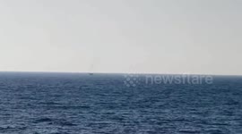 Gaza - Israeli naval boats fire their machine guns and water cannons towards Palestinian fishermen's boats