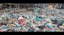 A coastal marine settlement living near garbage, in Belawan, North Sumatra, in the early hours of June 4, 2020.