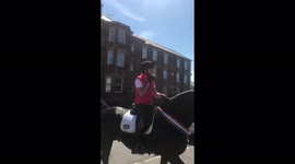 Riders returning The Queens Platinum Jubilee Parade eating ice cream to cool off