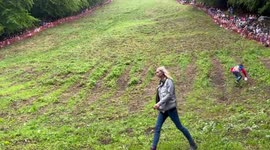 Participant helps prepare finish line ahead of first cheese rolling race of 2022